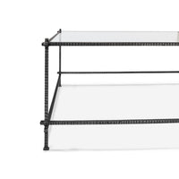 Side view, metal leg, glass surface, modern design.