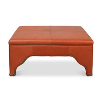 Front view of square leather cocktail ottoman.