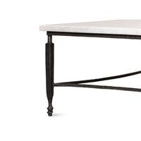 Metal leg detail of marble top coffee table.