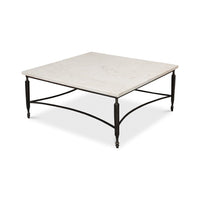 Angled view of minimalist marble coffee table with metal legs.