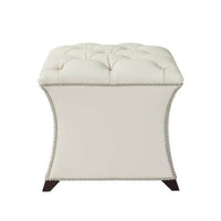 Front view of white square tufted stool with detailing.