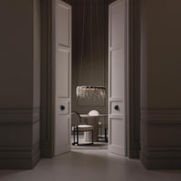 Elegant dining room with modern chairs and pendant light.