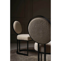 Pair of modern dining chairs in stylish interior setting.