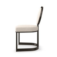 Side profile of modern dining chair with rounded back.