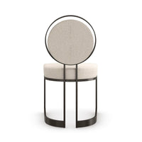 Rear view of modern dining chair with rounded back.