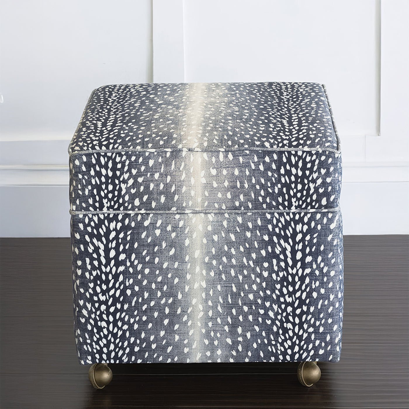 Front view of navy animal print storage ottoman cube.