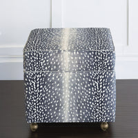 Front view of navy animal print storage ottoman cube.