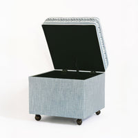 Open storage ottoman cube reveals spacious interior compartment.