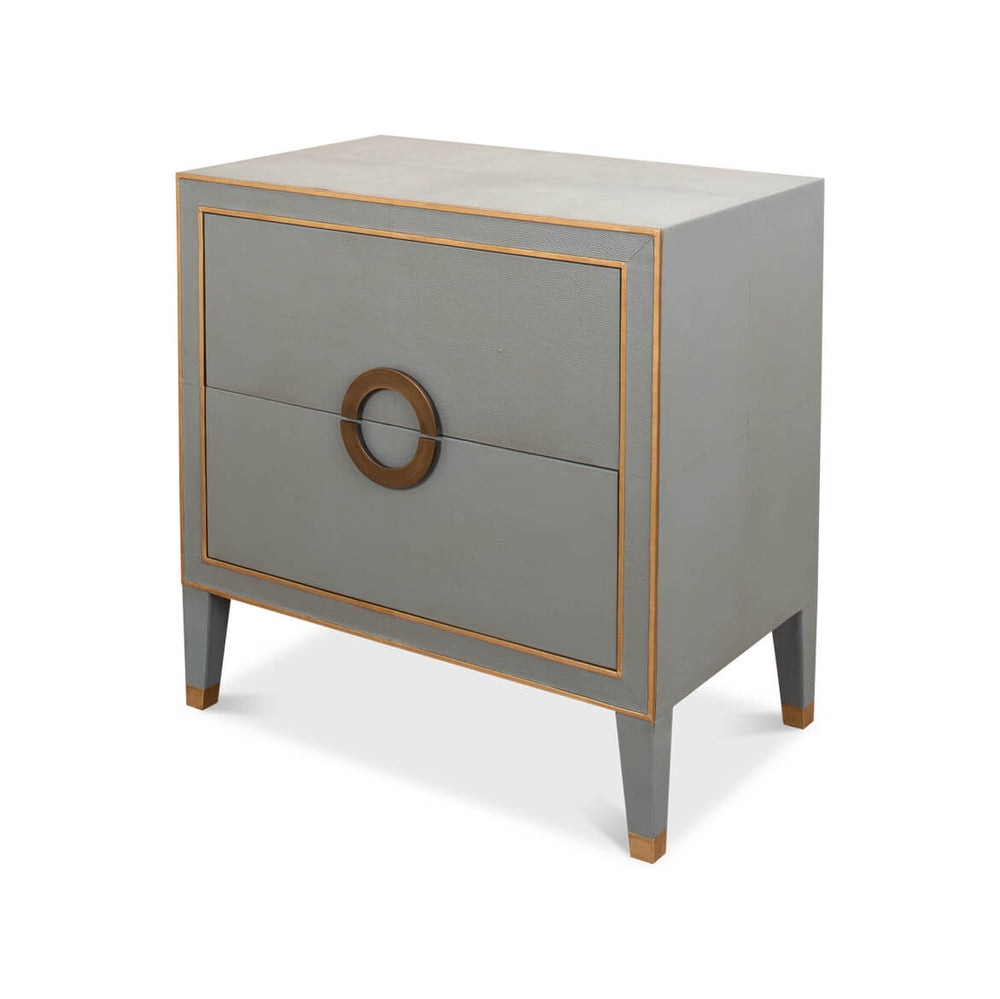 Gray nightstand with gold trim and circular handle.