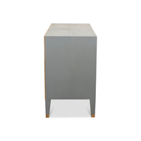 Side view of gray modern nightstand with gold trim.