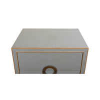 Top view of gray nightstand with gold trim.