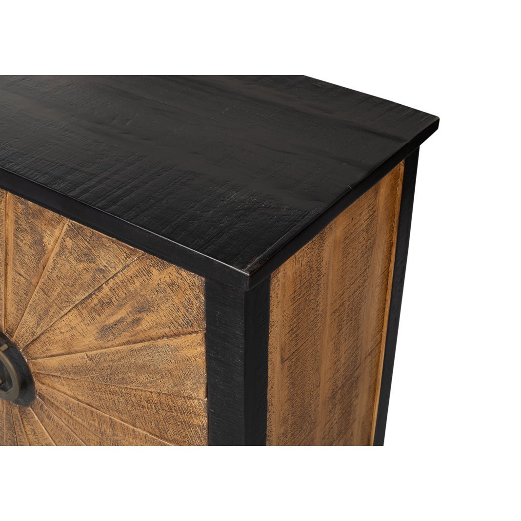 Top edge detail of sunburst wood cabinet.