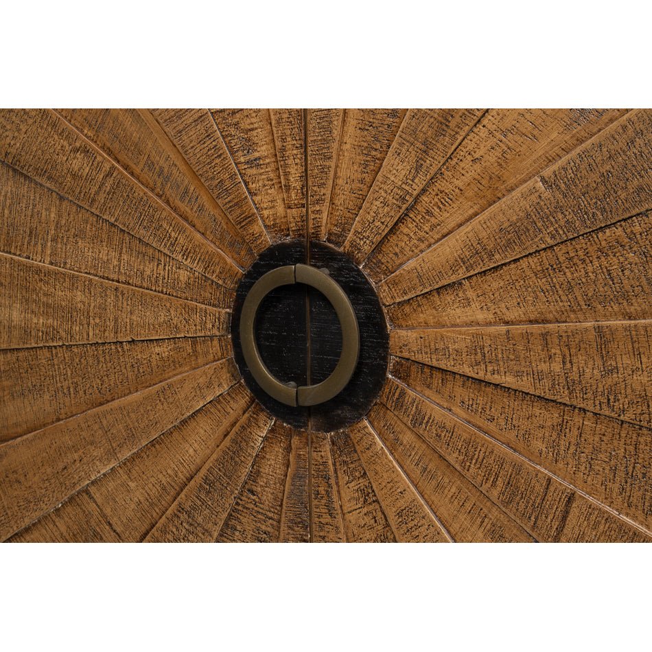 Sunburst wood cabinet circular handle detail.