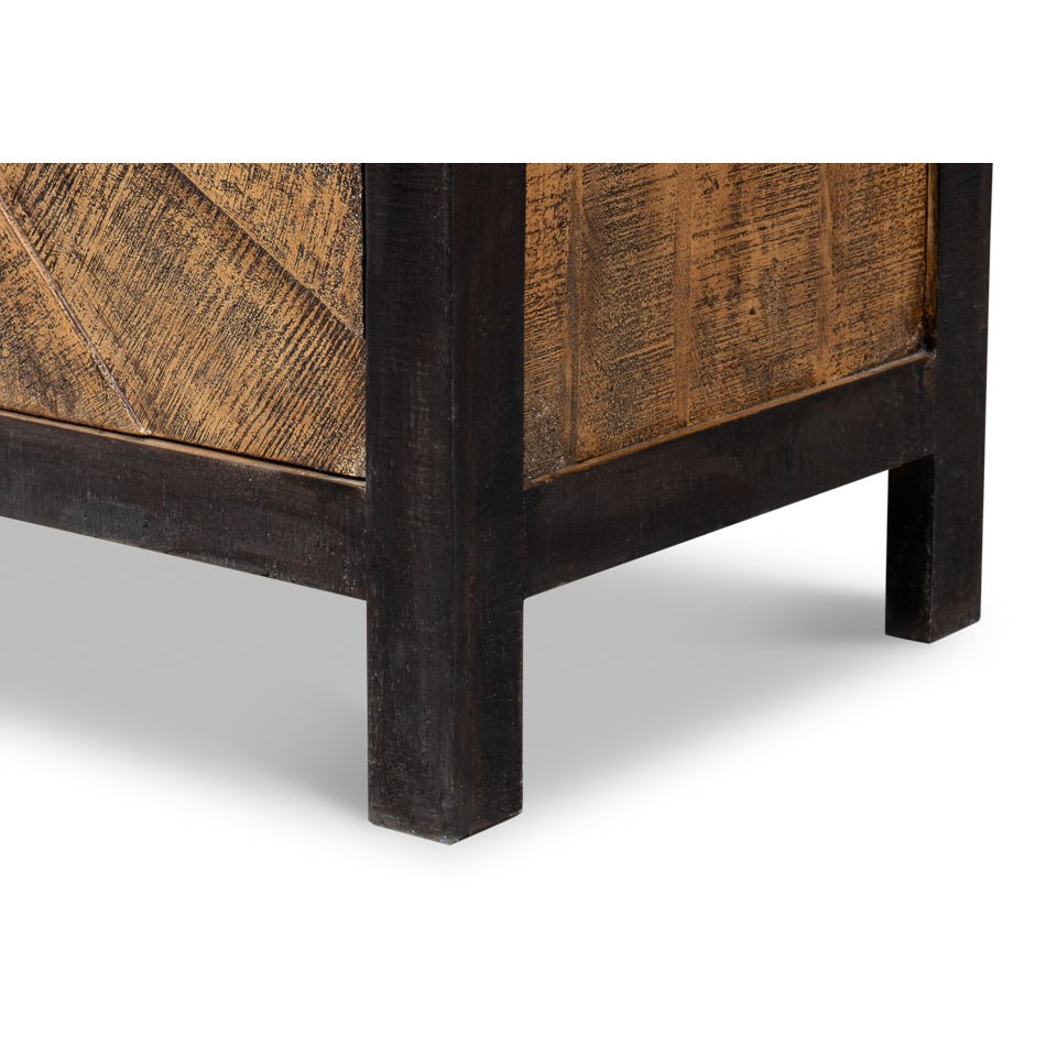 Lower corner detail of sunburst wood sideboard legs.