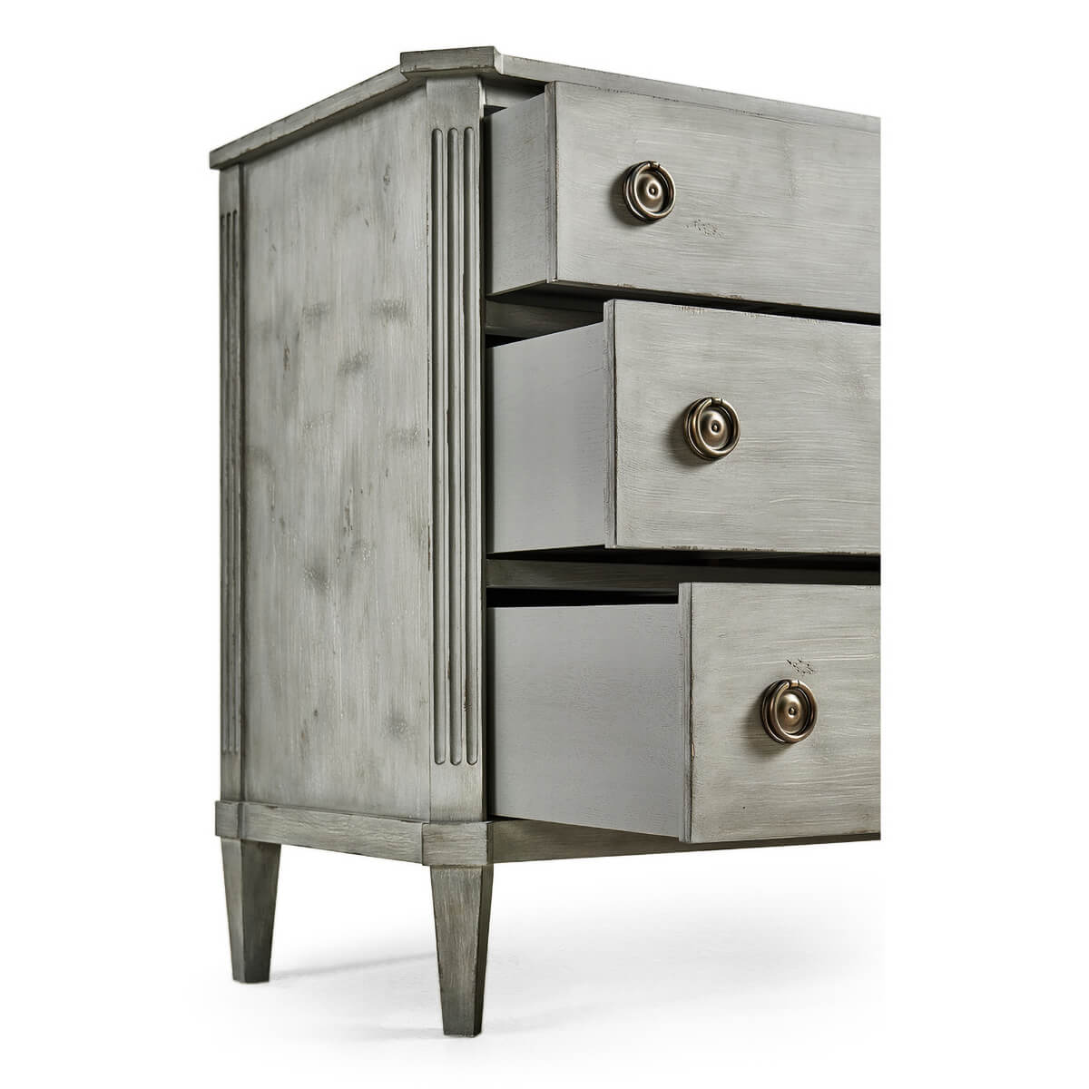 Open drawers of grey Swedish commode, side angle.