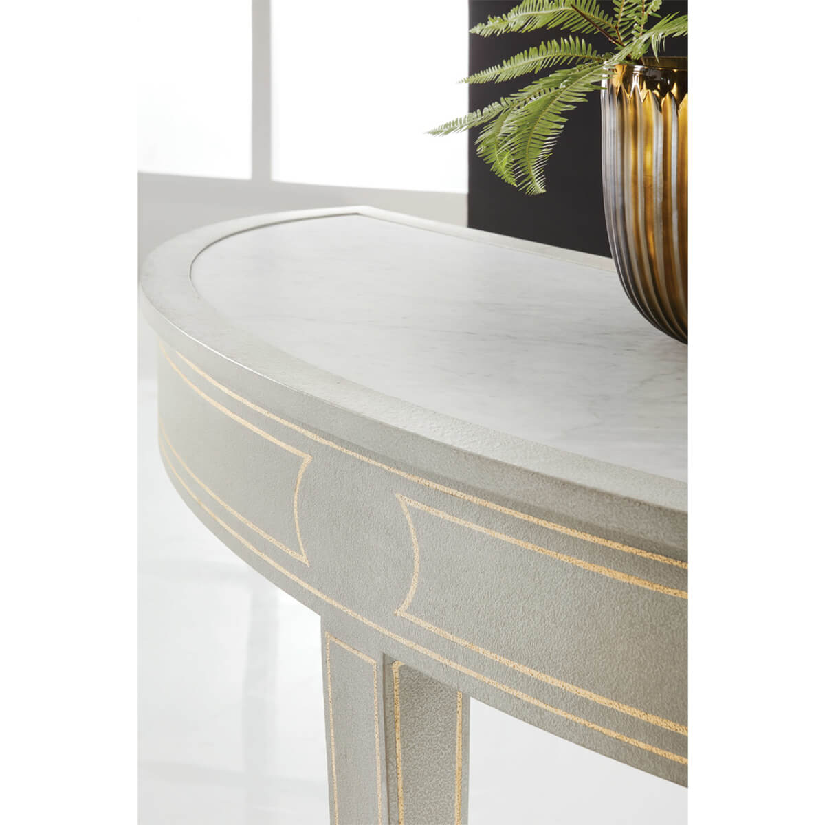 Close-up of painted console table detail with plant.