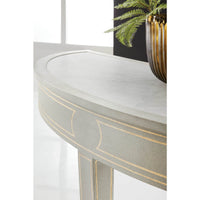 Close-up of painted console table detail with plant.