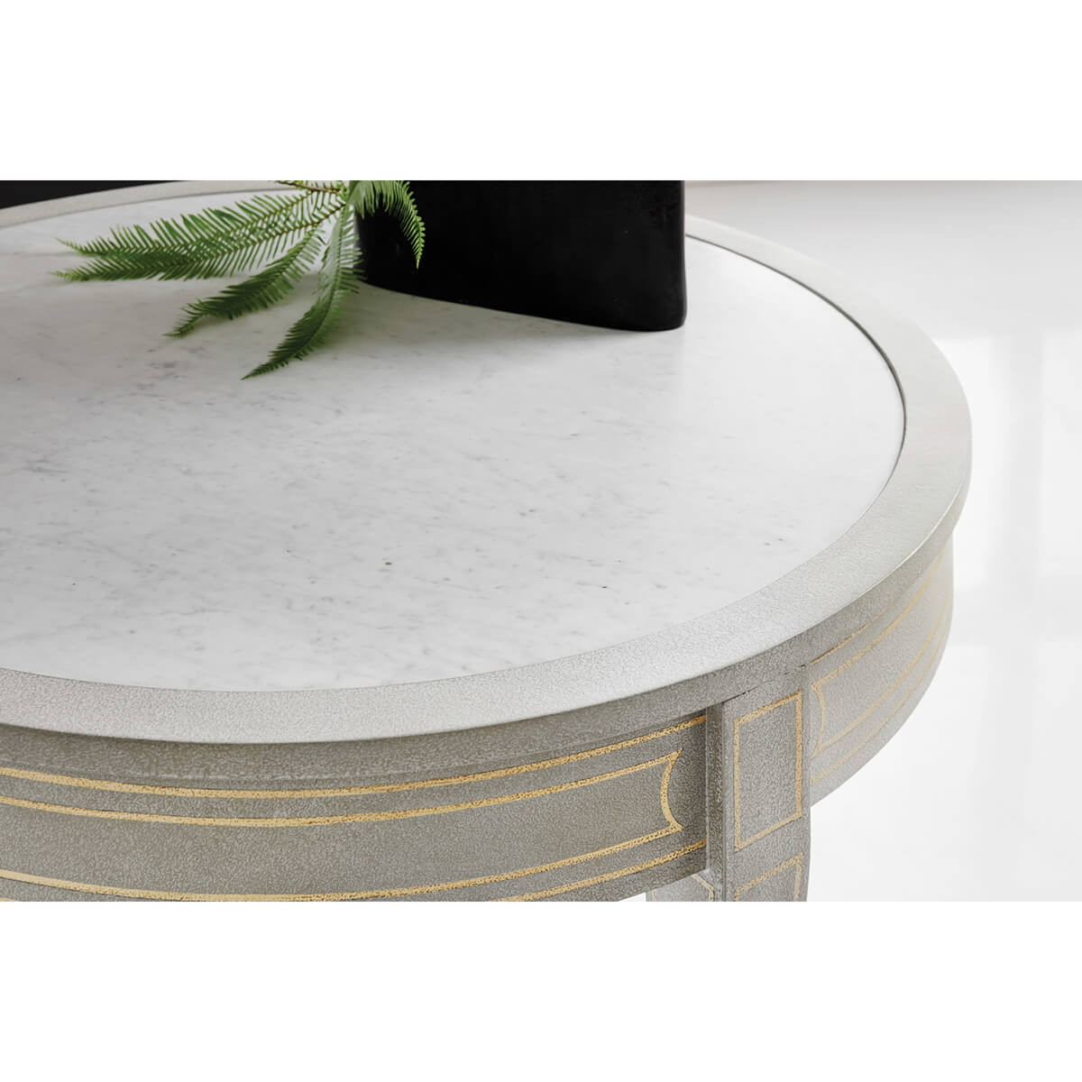 Close-up of round side table with marble top.