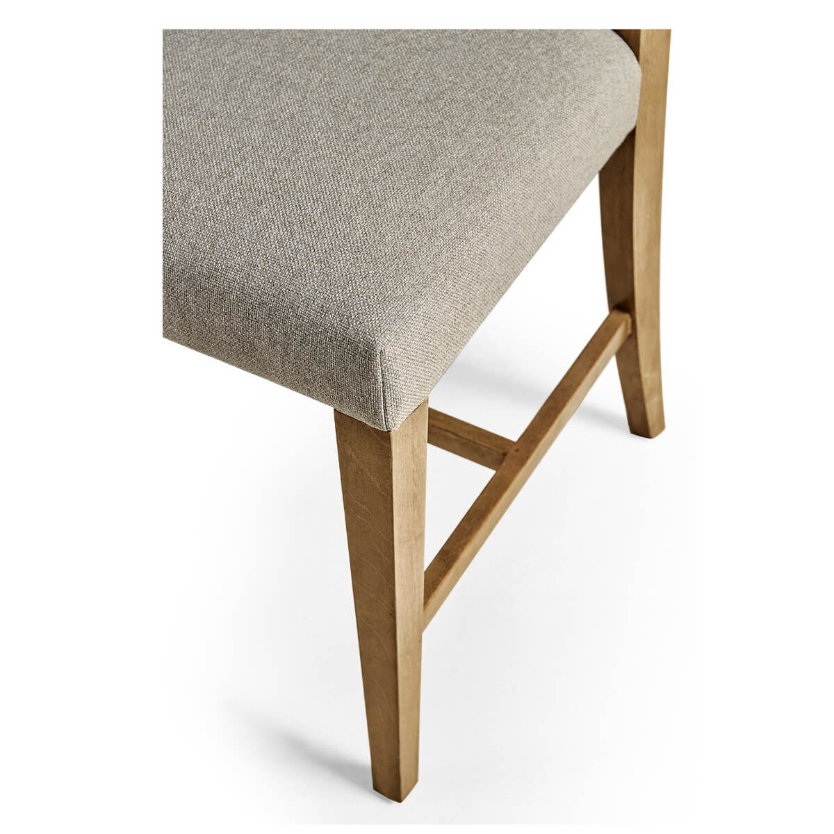 Close-up of chair seat and legs, bleached cherry wood.