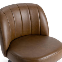 Close-up of the curved, channel-stitched brown leather back and padded seat