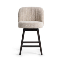 Front view of the cream fabric swivel counter stool with a rounded back and built-in footrest
