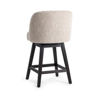 Three-quarter rear view of the cream fabric swivel counter stool showing its curved upholstered back