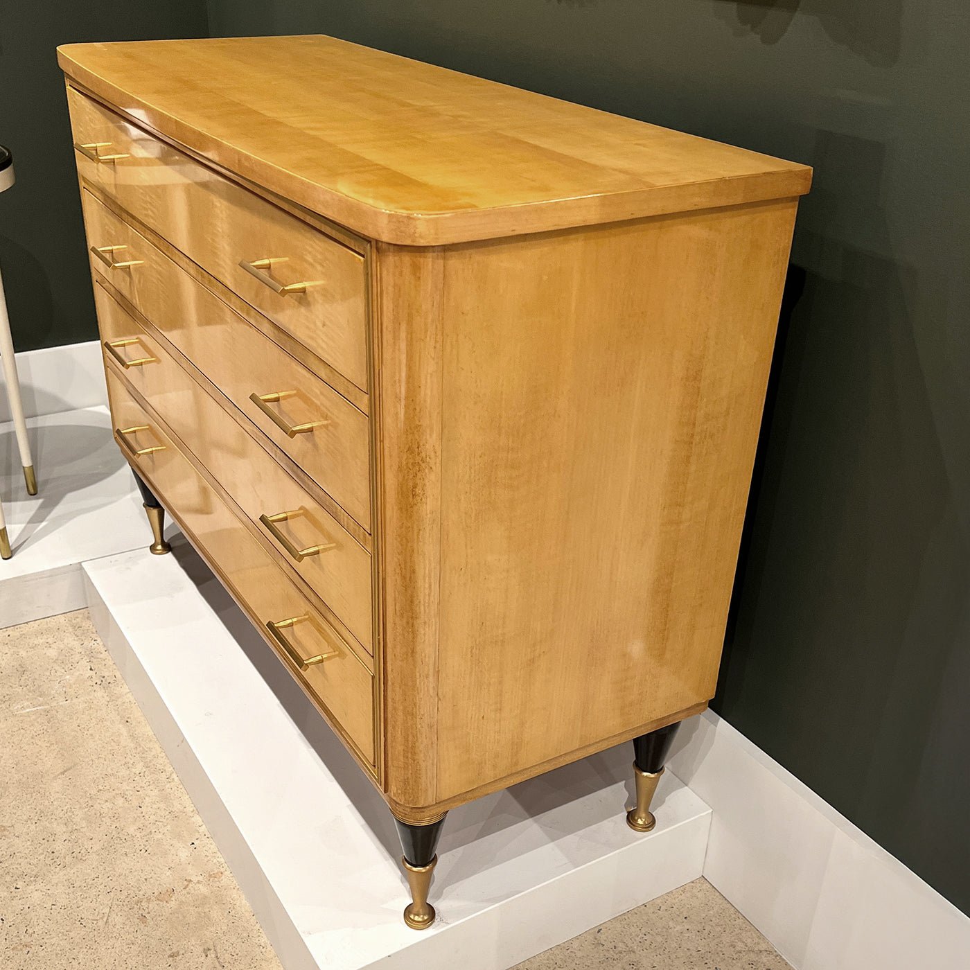 Side angle of sycamore mid-century chest.