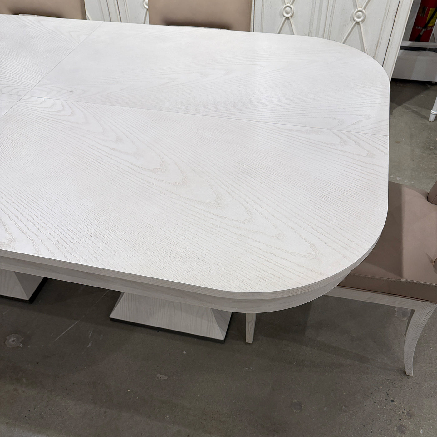 Dining table surface with detailed wood grain pattern.