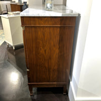 Side view of Tall Empire chest, showing wood grain.