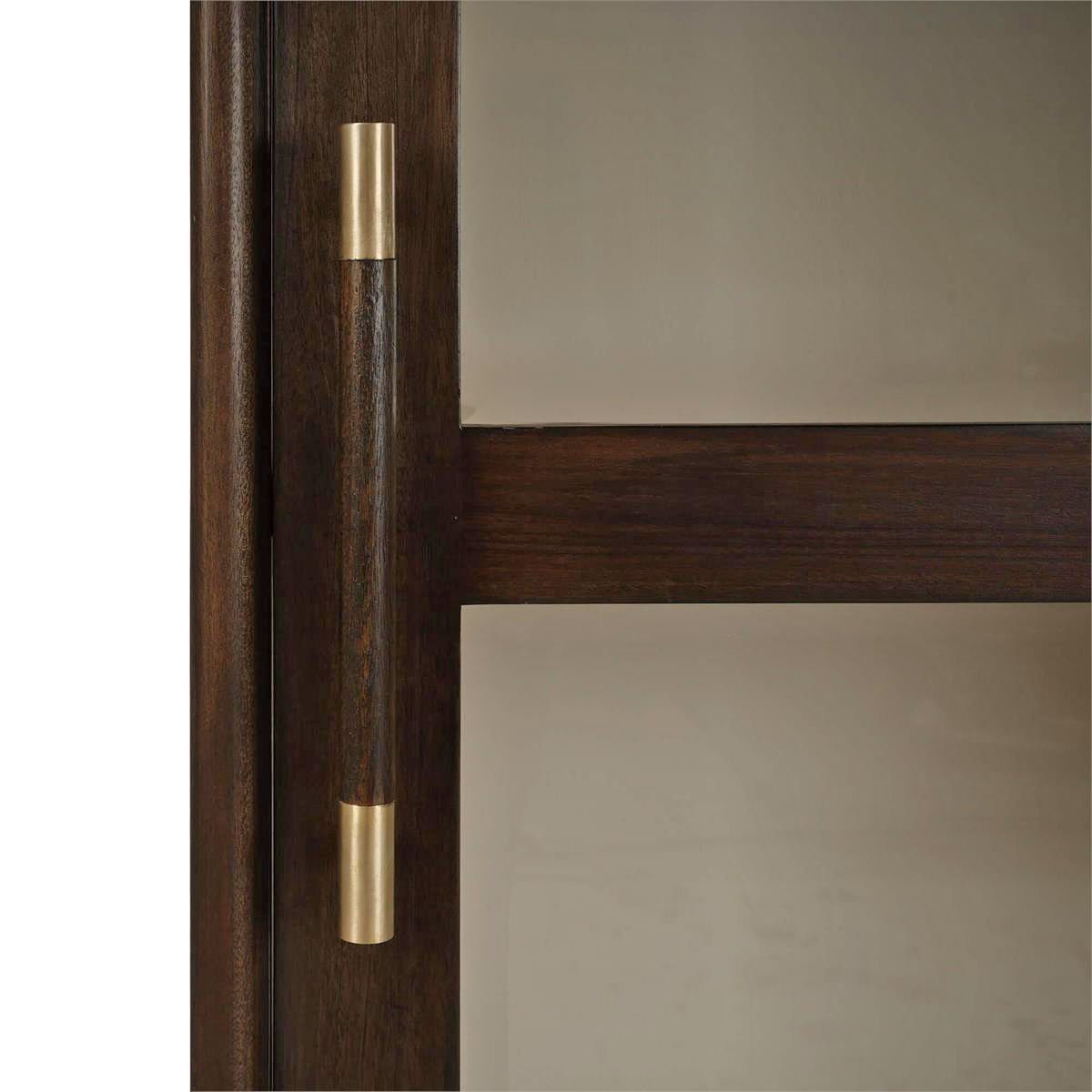 Detailed close-up of cabinet door handle and glass.
