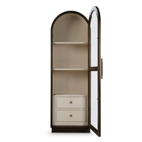 Open tall glass door display cabinet with drawers visible.