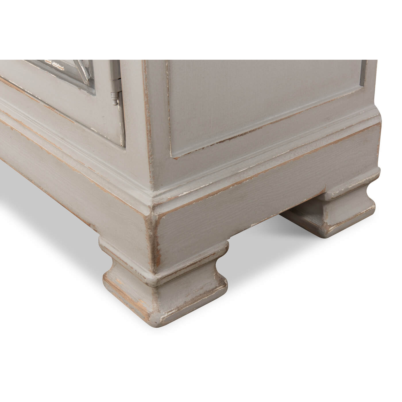 Cabinet base close-up, showing feet design.