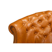 Close-up, chair upper backrest and armrest detail.