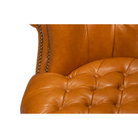 Close-up, chair seat button tufting detail.