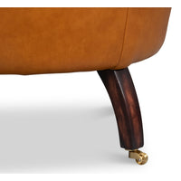 Chair rear leg detail, wood with caster wheel.
