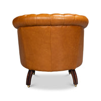 Tan leather barrel chair, full rear view.