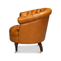 Tan leather barrel chair, left side angle view.