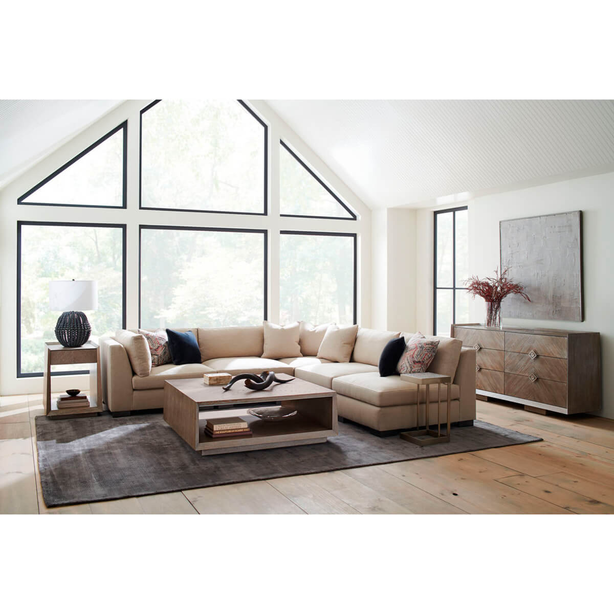 Tapered ash coffee table in living room setting.