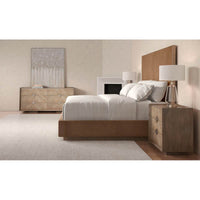 Bedroom with taupe king bed and matching furniture.