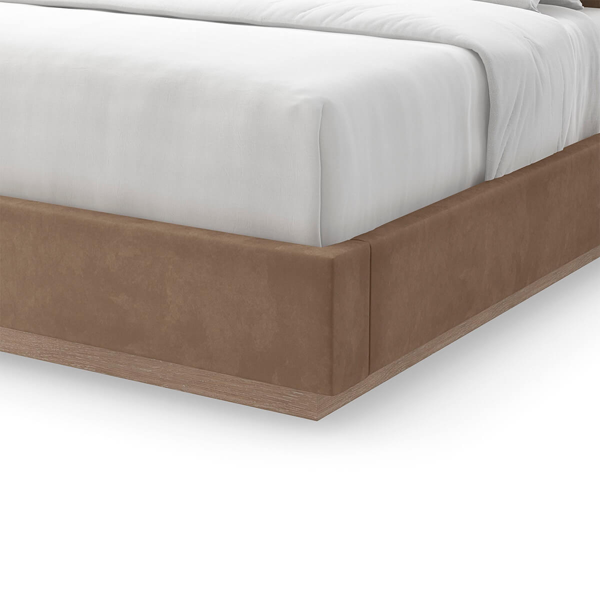 Close-up of taupe king bed upholstery and base.