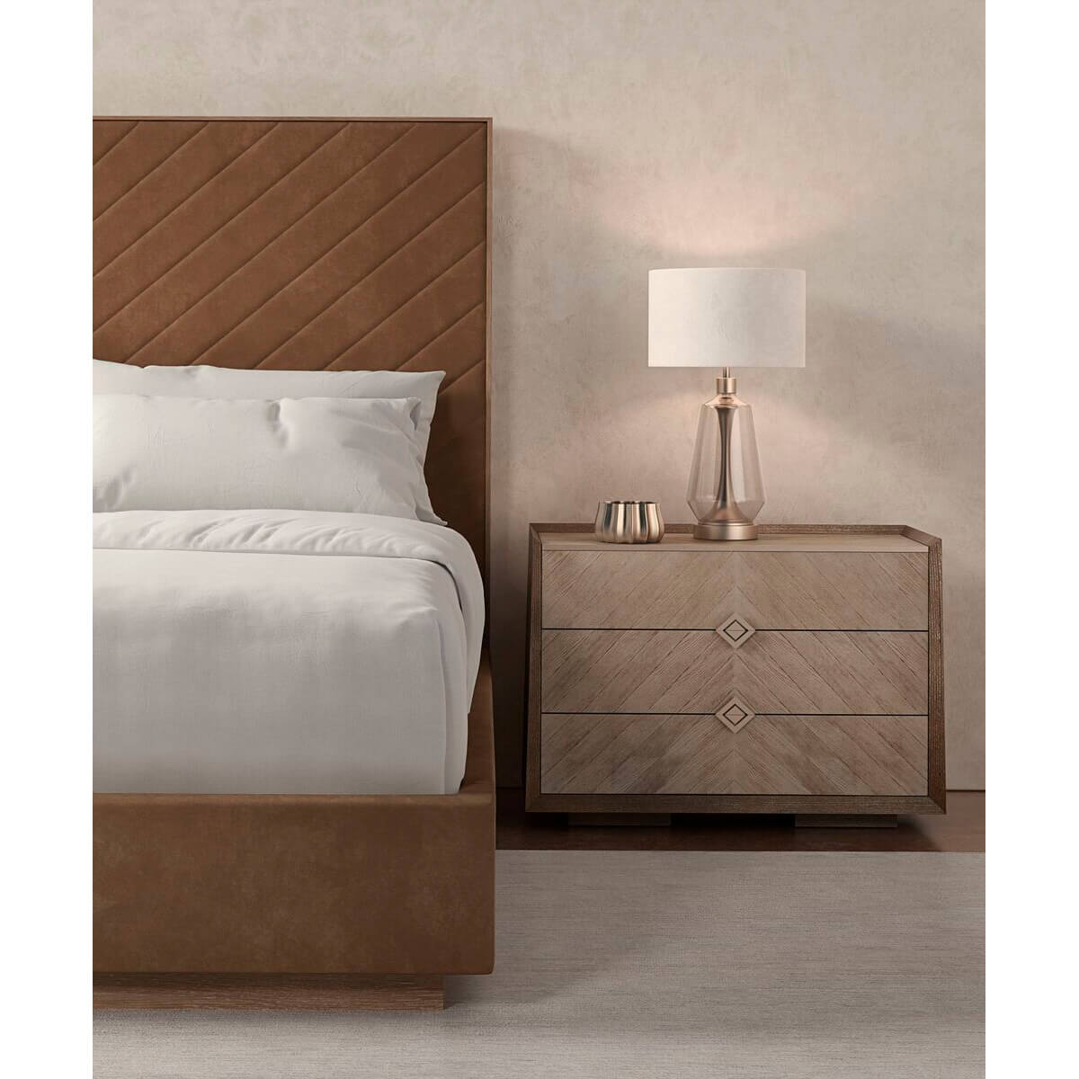 Taupe king bed beside nightstand, white lamp visible.
