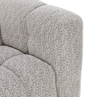 Close-up of gray sectional rounded arm and back with nubby textured upholstery