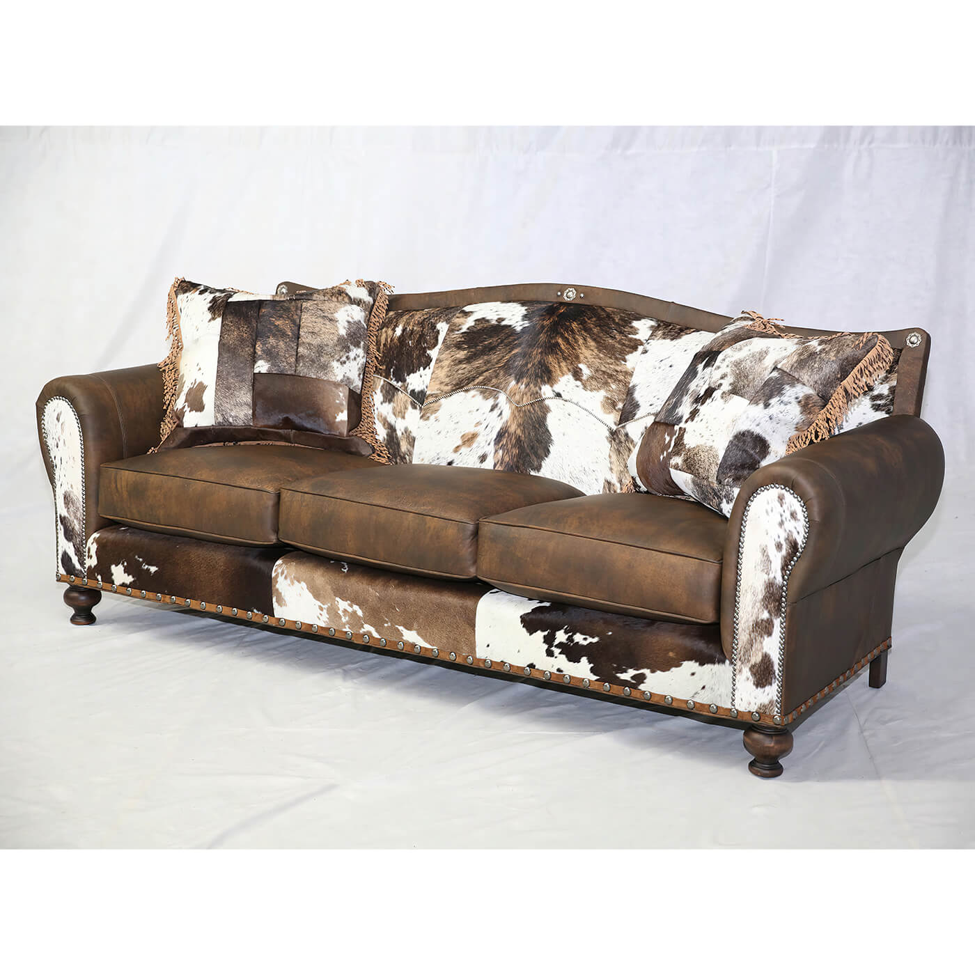 Full view of western sofa, wood legs, rustic design.