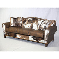 Full view of western sofa, wood legs, rustic design.