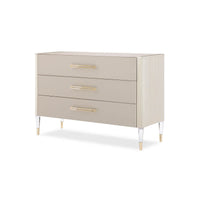 Elegant three-drawer modern dresser with gold accents.