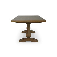Side profile of wooden trestle dining table.