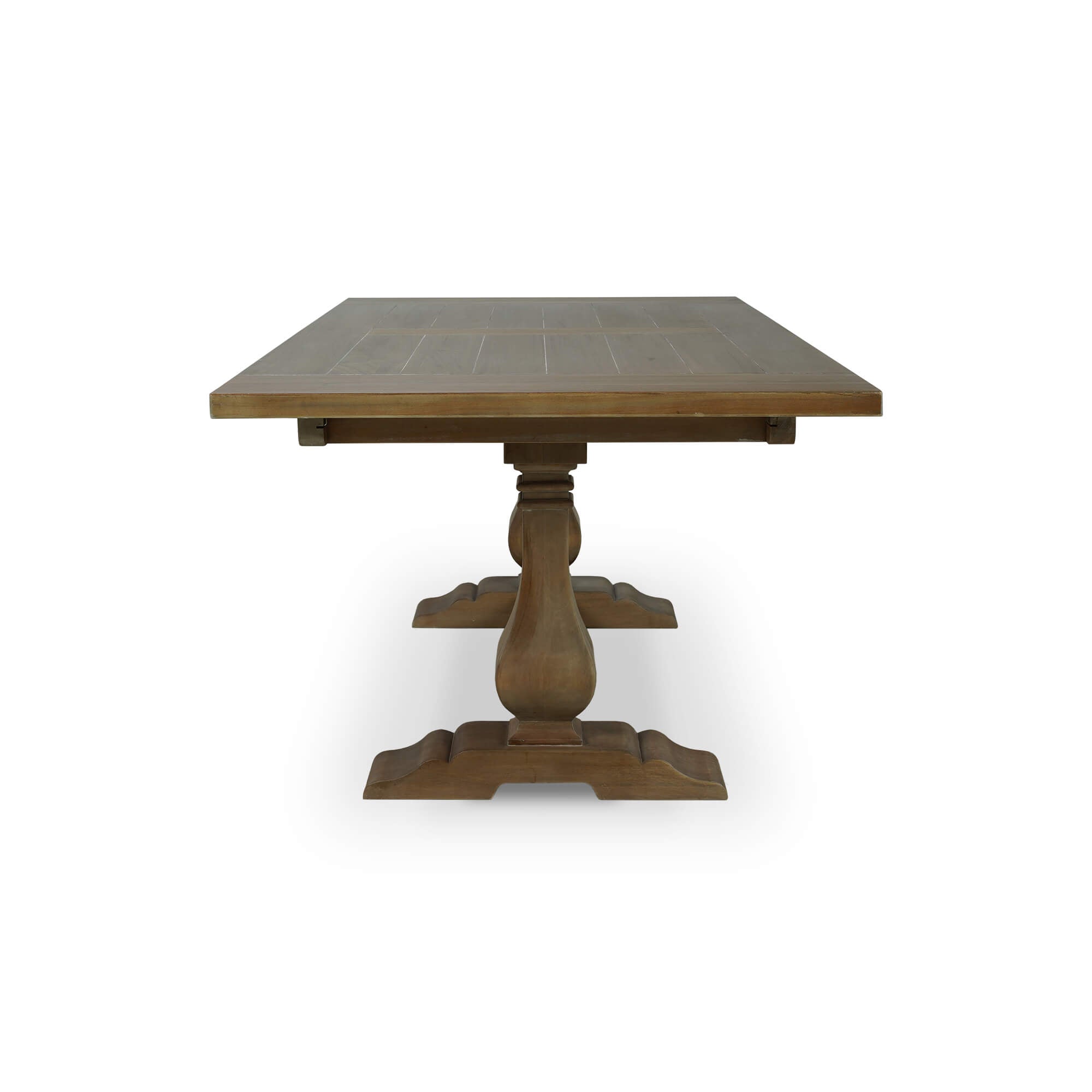 Side profile of wooden trestle dining table.