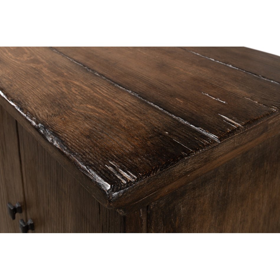 Close view of distressed wood finish on sideboard.