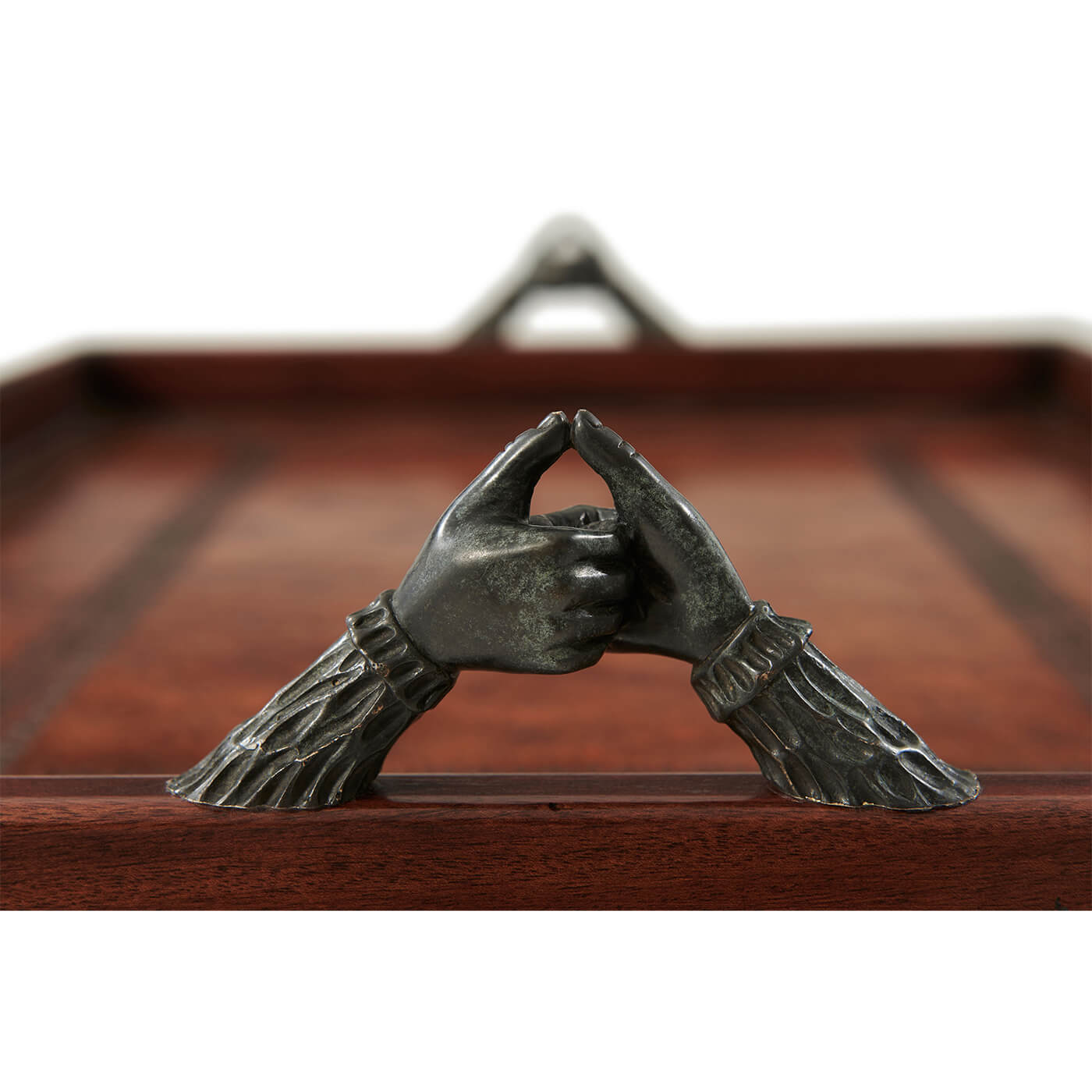 Detailed view of elegant handle on serving tray.
