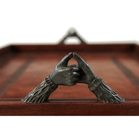 Detailed view of elegant handle on serving tray.